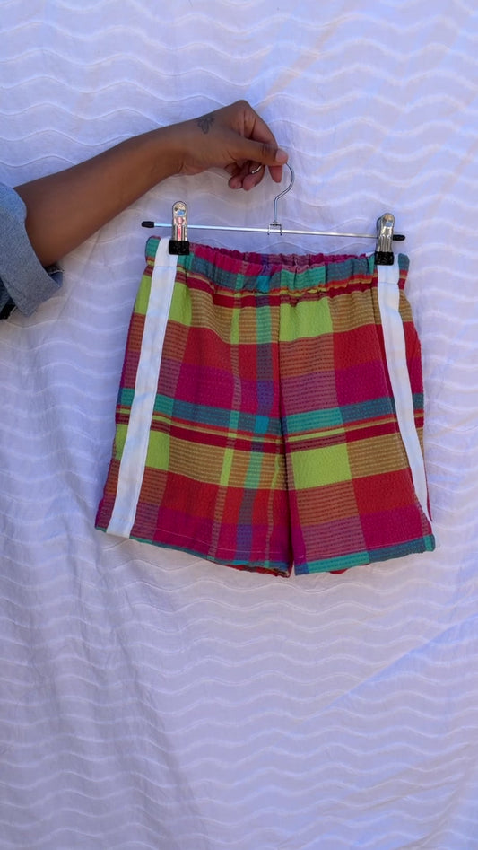Pink multi check print short  Size / Age: 9-10